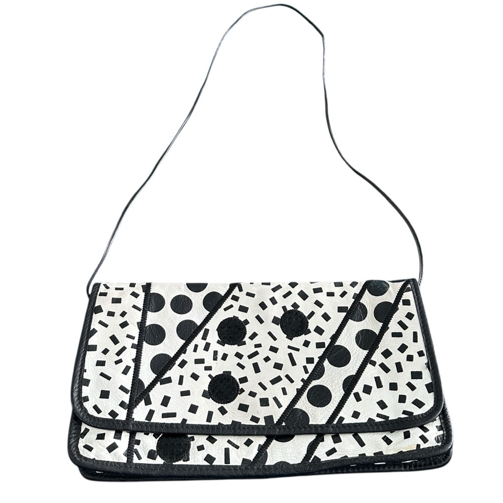 Vintage luxury handbag from Carlos Falchi. Leather with python accents